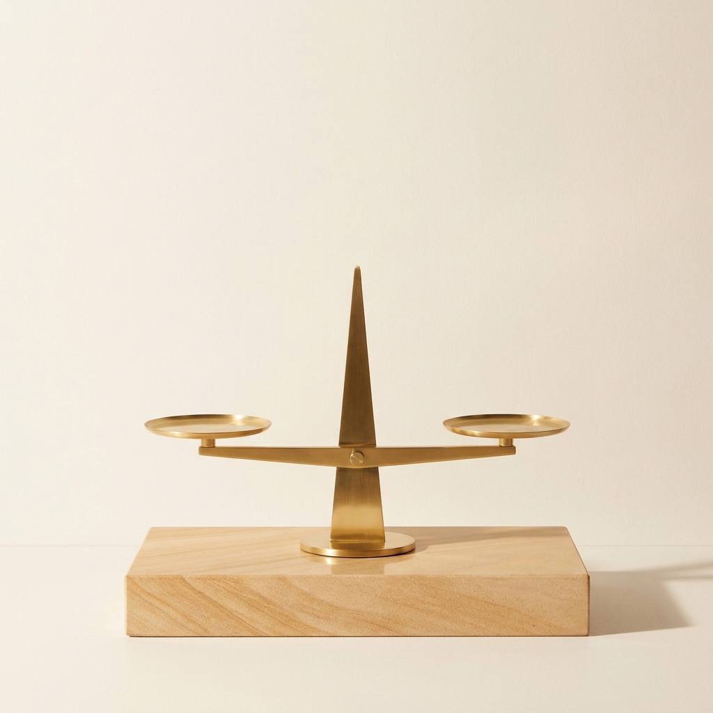 Minimalist modern brass balance scale on sandstone plinth